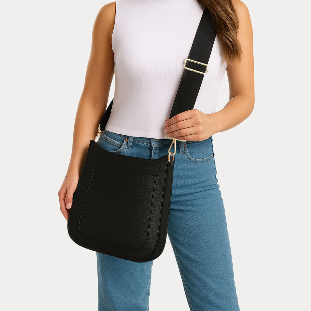 Woman wearing the Maxine Vegan Pebble Leather Messenger in Black as a crosbbody