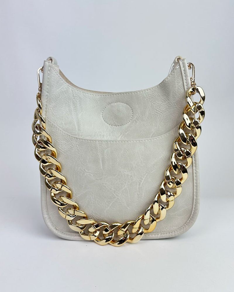 Cream handbag with gold resin chain bag strap