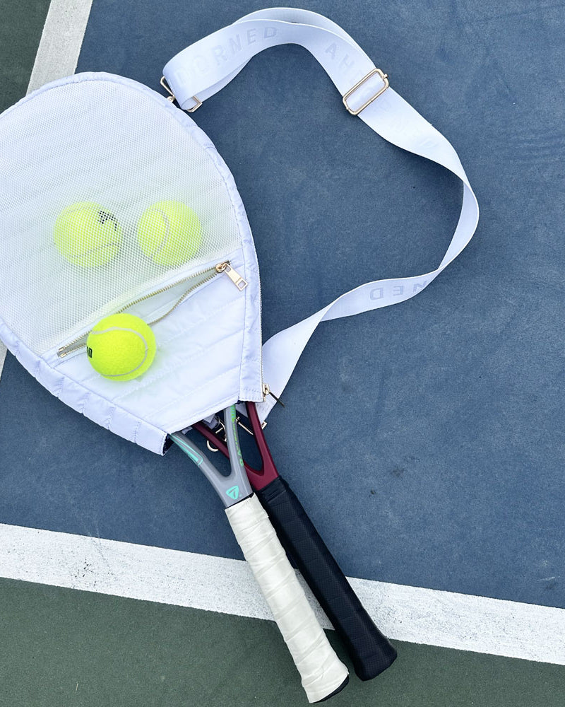 Piper Quilted Nylon Tennis Racket Back in White on the tennis court