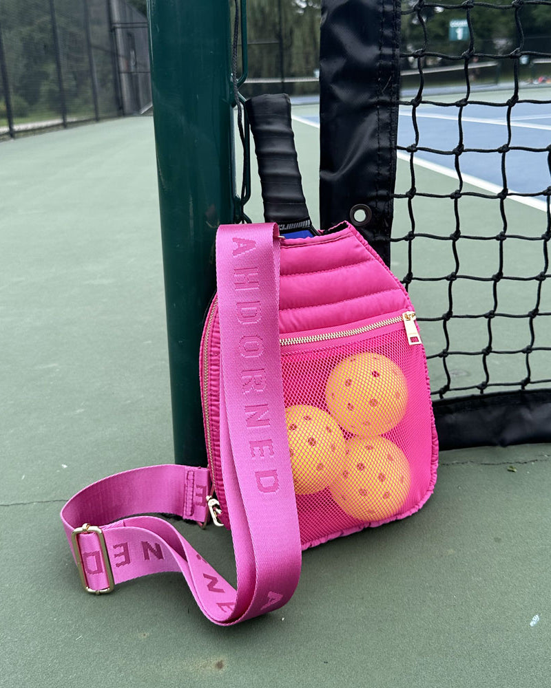 Poppy Quilted Nylon Pickleball Paddle Bag in Pink on pickleball court