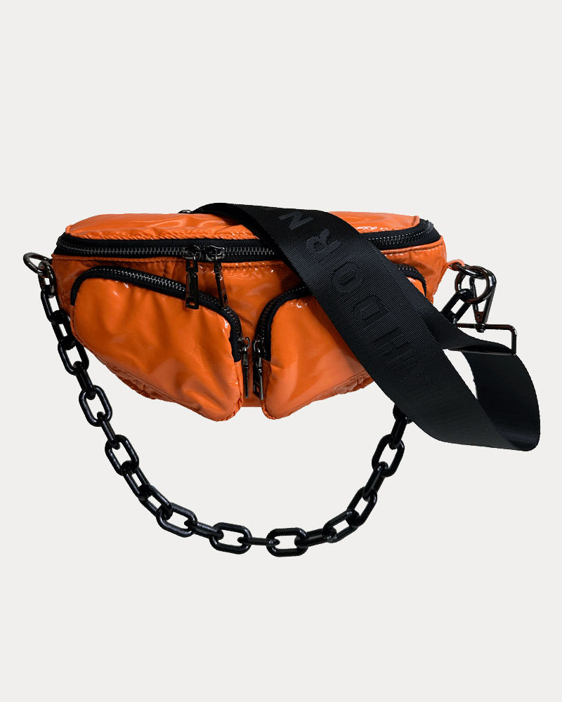 Rachel Nylon Sling Bag in Orange, shown with resin chain and black adjustable strap
