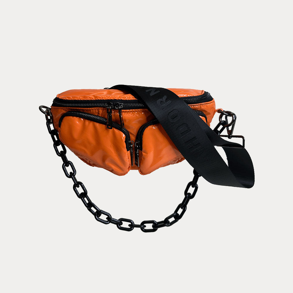 Rachel Nylon Sling Bag in Orange, shown with resin chain and black adjustable strap