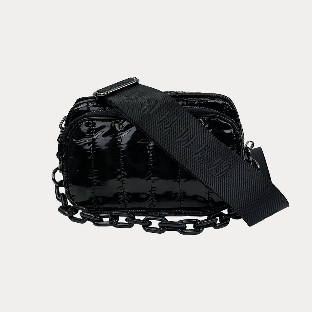 Ramona Quilted Nylon Crossbody in Black, shown with resin chain and black adjustable strap