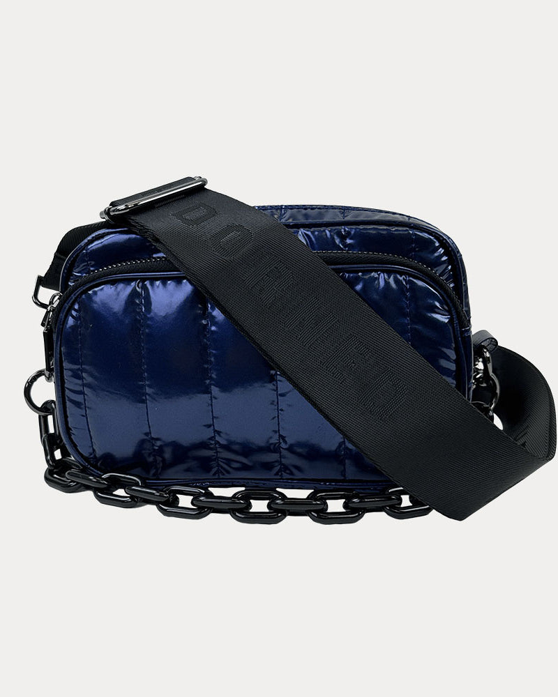 Ramona Quilted Nylon Crossbody in Navy, shown with resin chain and black adjustable strap
