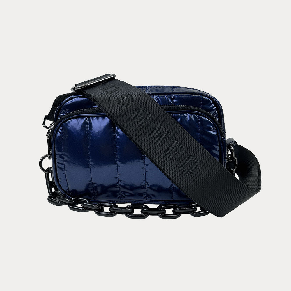 Ramona Quilted Nylon Crossbody in Navy, shown with resin chain and black adjustable strap