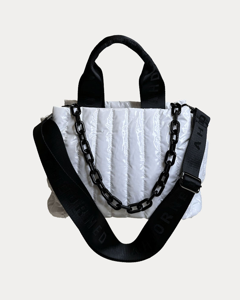 Rosie Quilted Nylon Tote in White, shown with resin chain and black adjustable strap