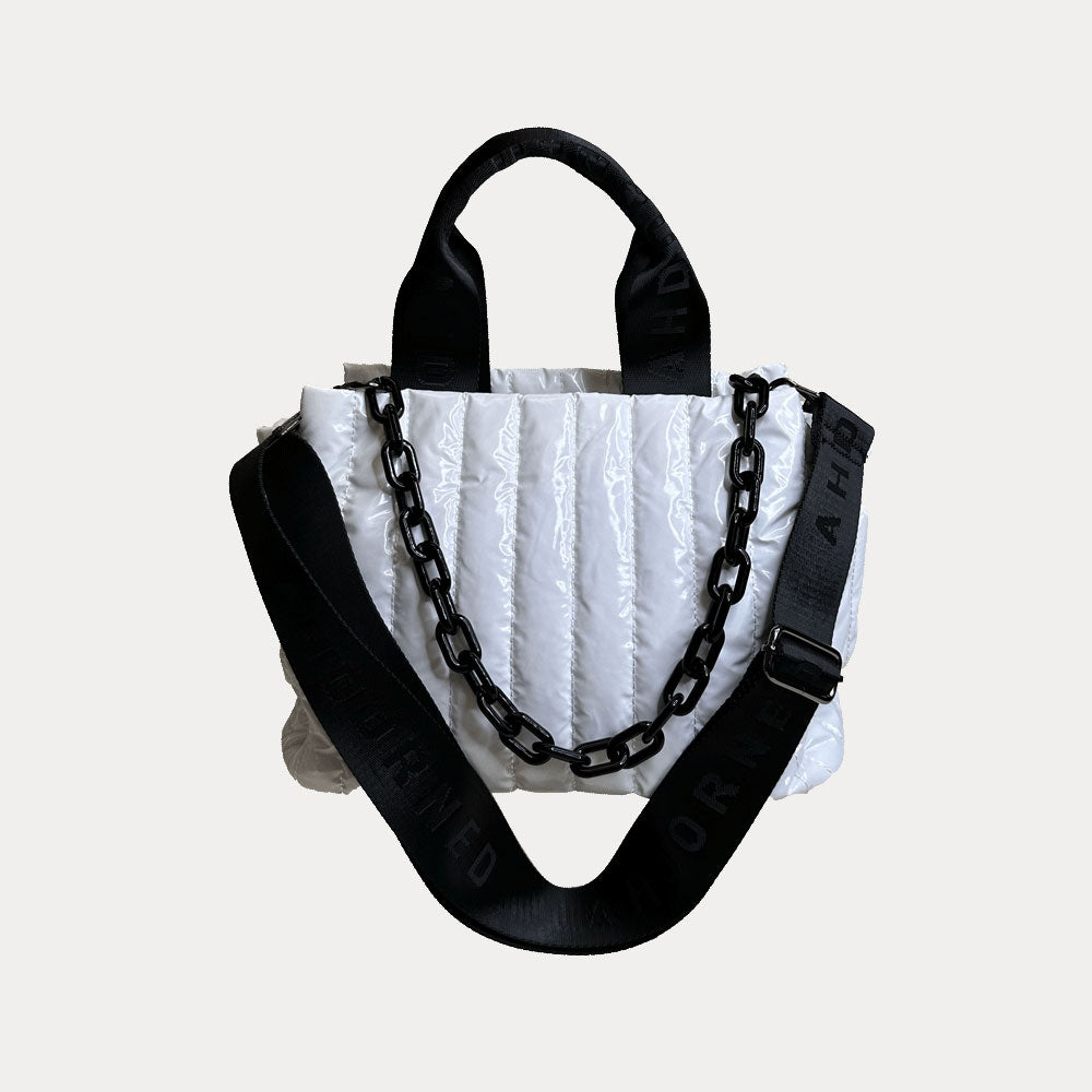 Rosie Quilted Nylon Tote in White, shown with resin chain and black adjustable strap