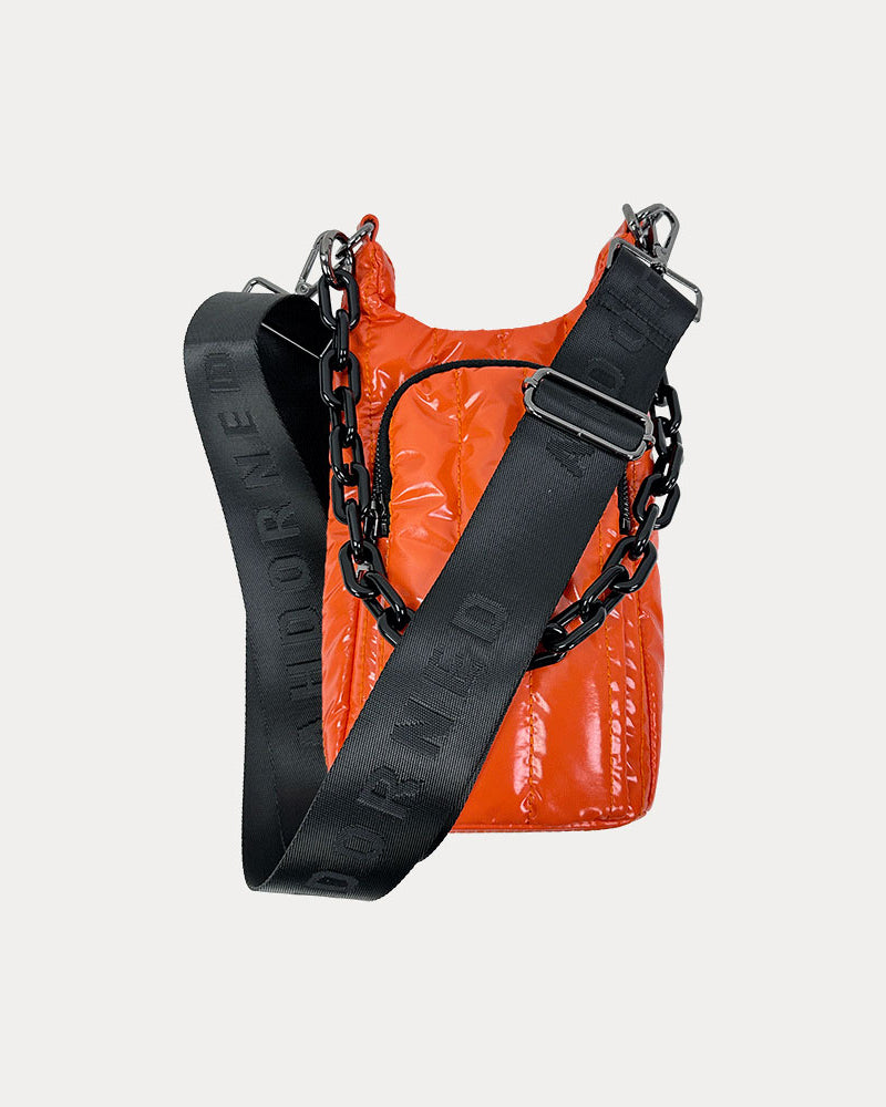 Roxy Quilted Nylon Water Bottle bag in Orange, shown with resin chain and black adjustable strap
