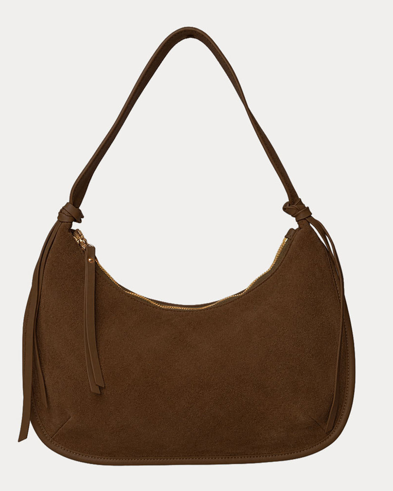 Chocolate vegan suede handbag on a light gray background