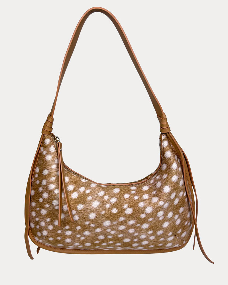 Handbag with deer pattern and camel trim on a light gray background