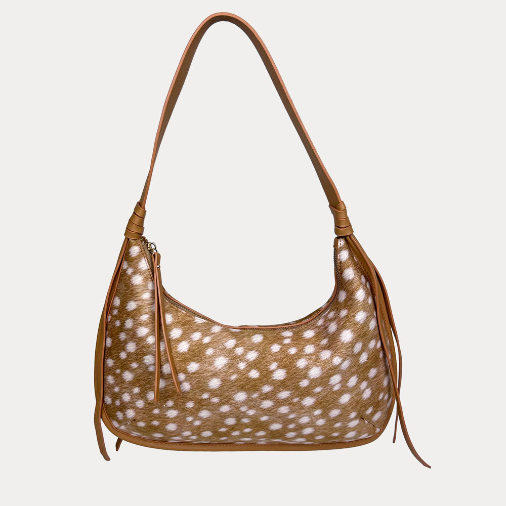 Handbag with deer pattern and camel trim on a light gray background