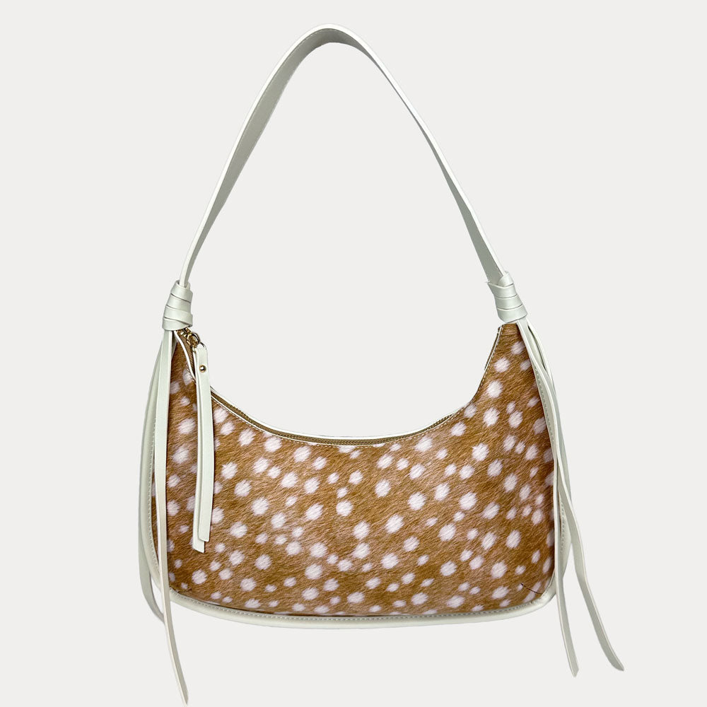 Handbag with deer pattern with cream vegan leather details on a light gray background