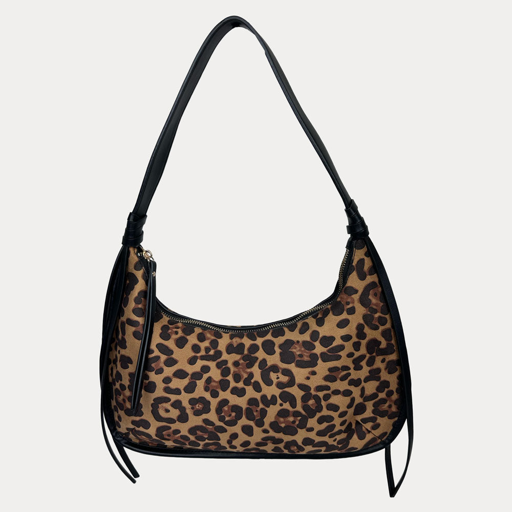 Leopard print handbag with black handle on a light gray background