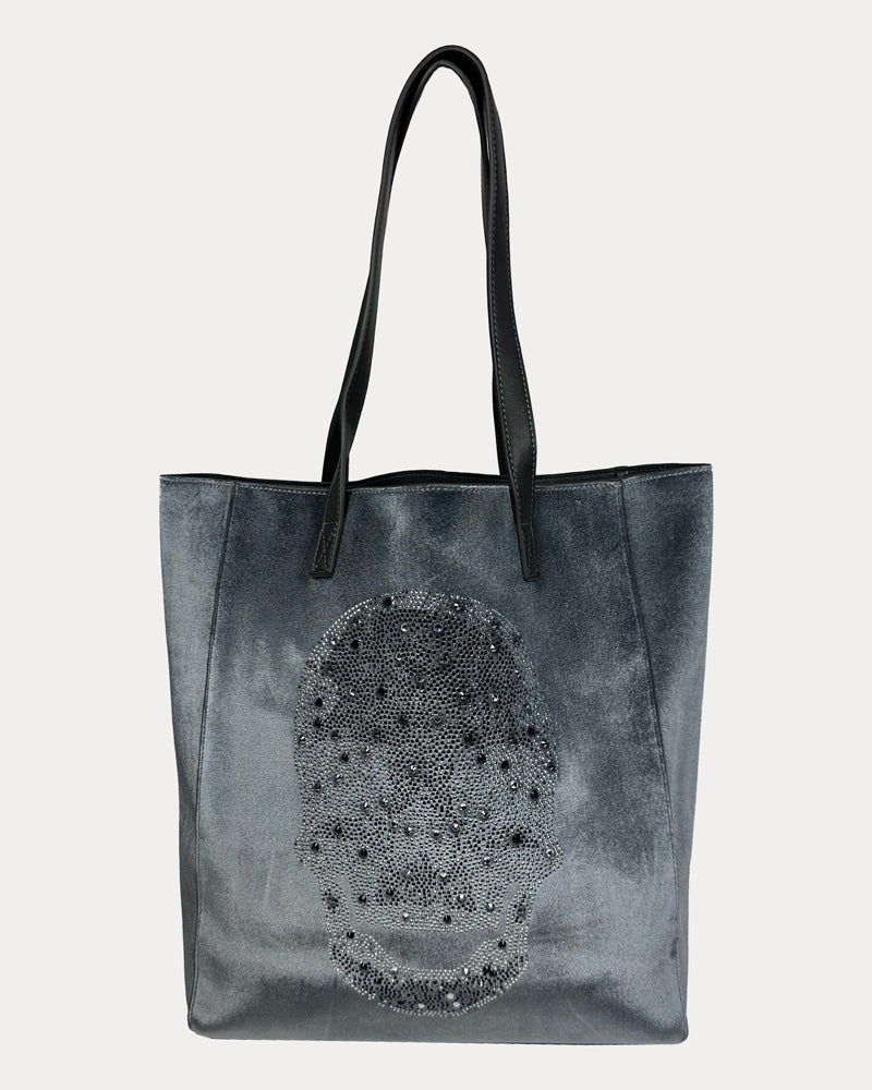 Gray tote bag with skull rhinestone embelishment on a light gray background