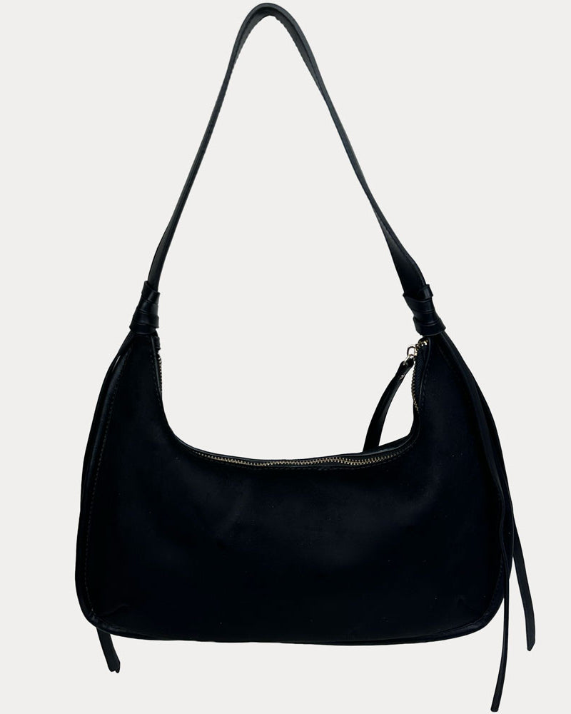 A black leather shoulder bag with a vegan leather shoulder strap, shown against a plain light gray background.