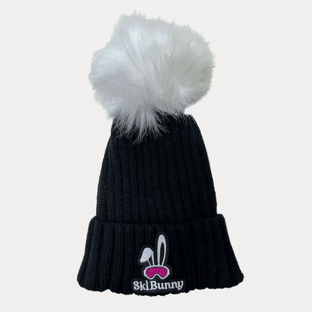 Black ski bunny hat with white pom pom and pink ski bunny patch