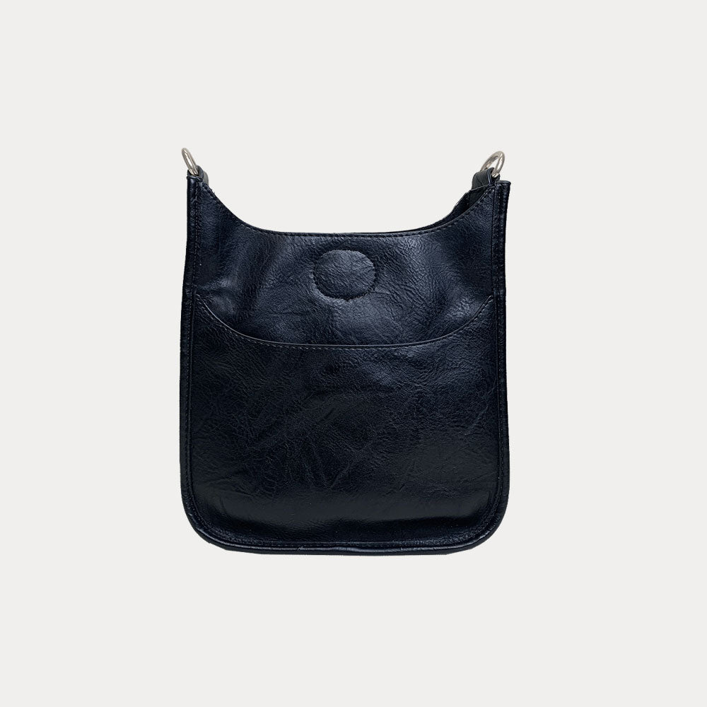 Mini Vegan Leather Messenger in Black with Silver hardware on a grey background.