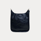 Mini Vegan Leather Messenger in Black with Silver hardware on a grey background.