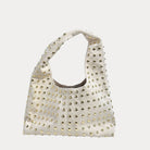 Cream Vegan Suede Tote with gold studs on a white background