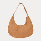 Ginger vegan suede handbag with studs on a light gray background
