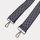 Navy, tan, and blue zig zag pattern bag strap with gold hardware 