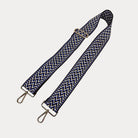 Navy, tan, and blue zig zag pattern bag strap with gold hardware 