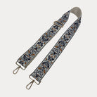 Cream ground Floral pattern bag strap  with gold metal clasps on a light gray background