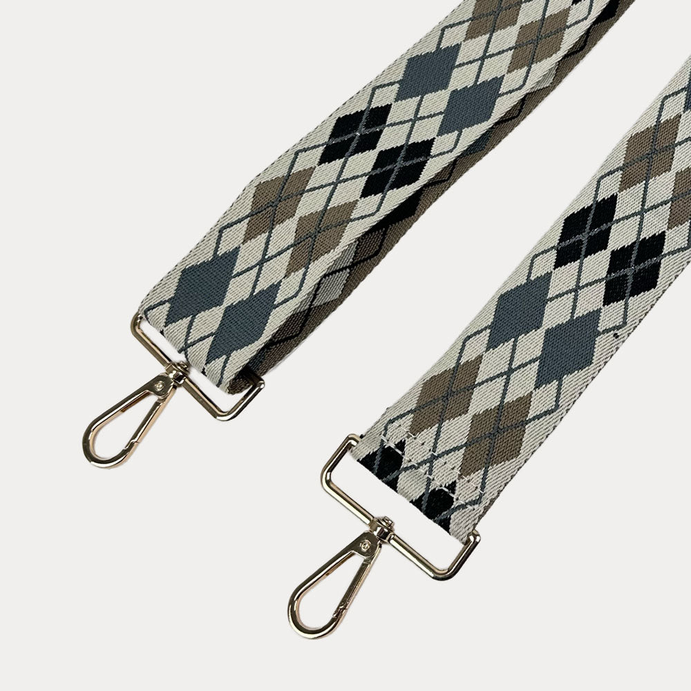 Cream, Black, Grey, Tan Argyle Pattern Bag Strap with gold metal clasps on a white background