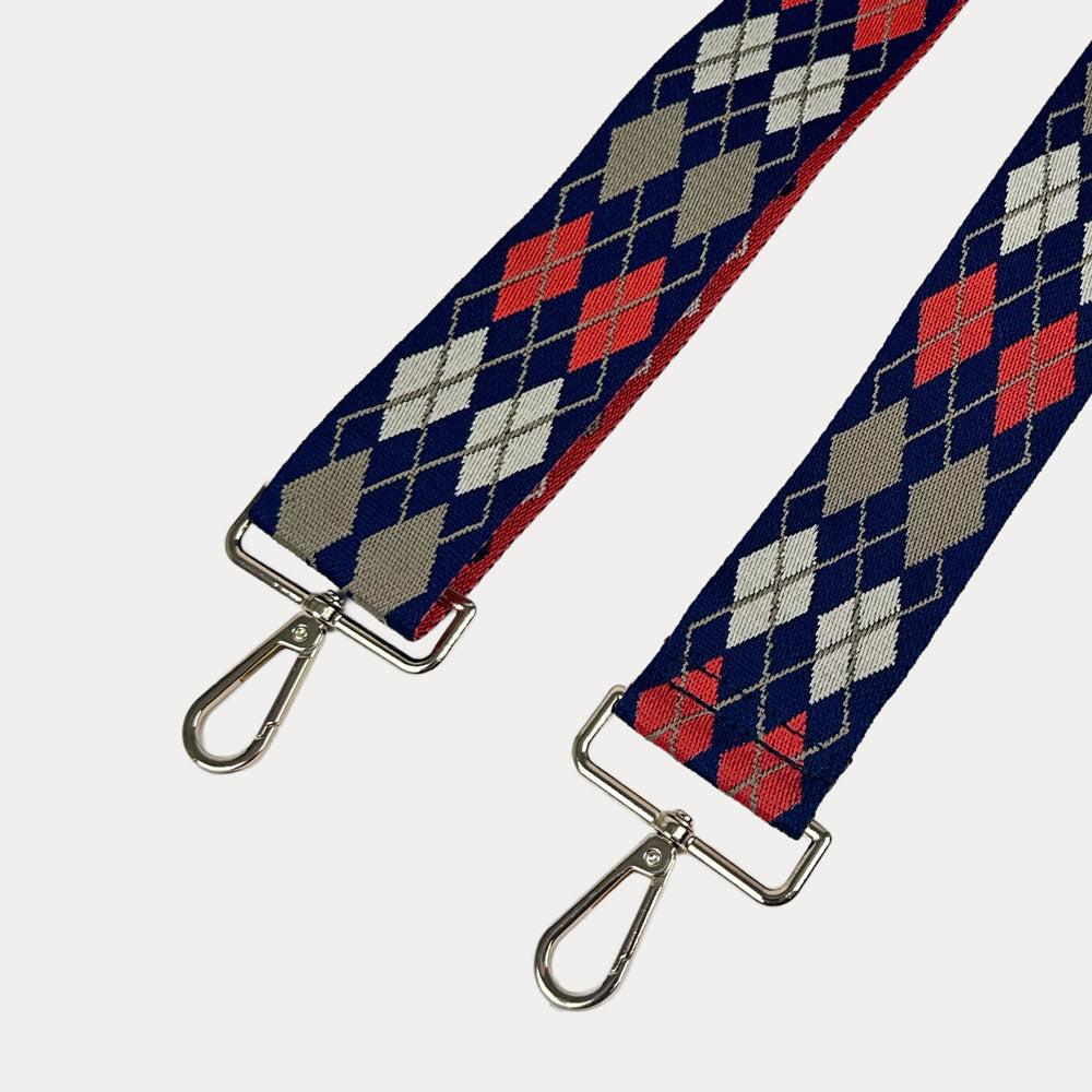Navy, Orange, Tan Argyle Pattern Bag strap with gold metal clasps on a white background