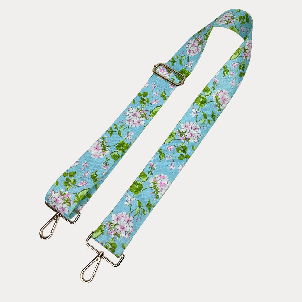 Aqua Ground Floral patterned strap with gold metal clasps on a white background