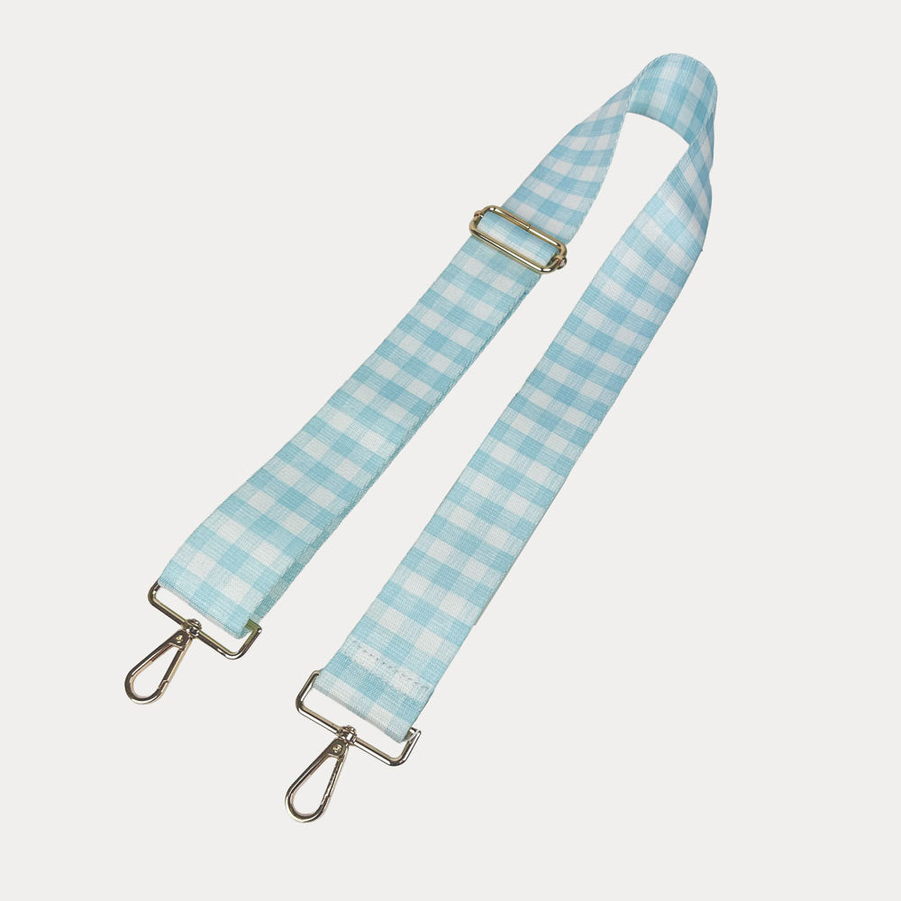 Aqua and white checkered strap with gold metal clasps on a light gray background