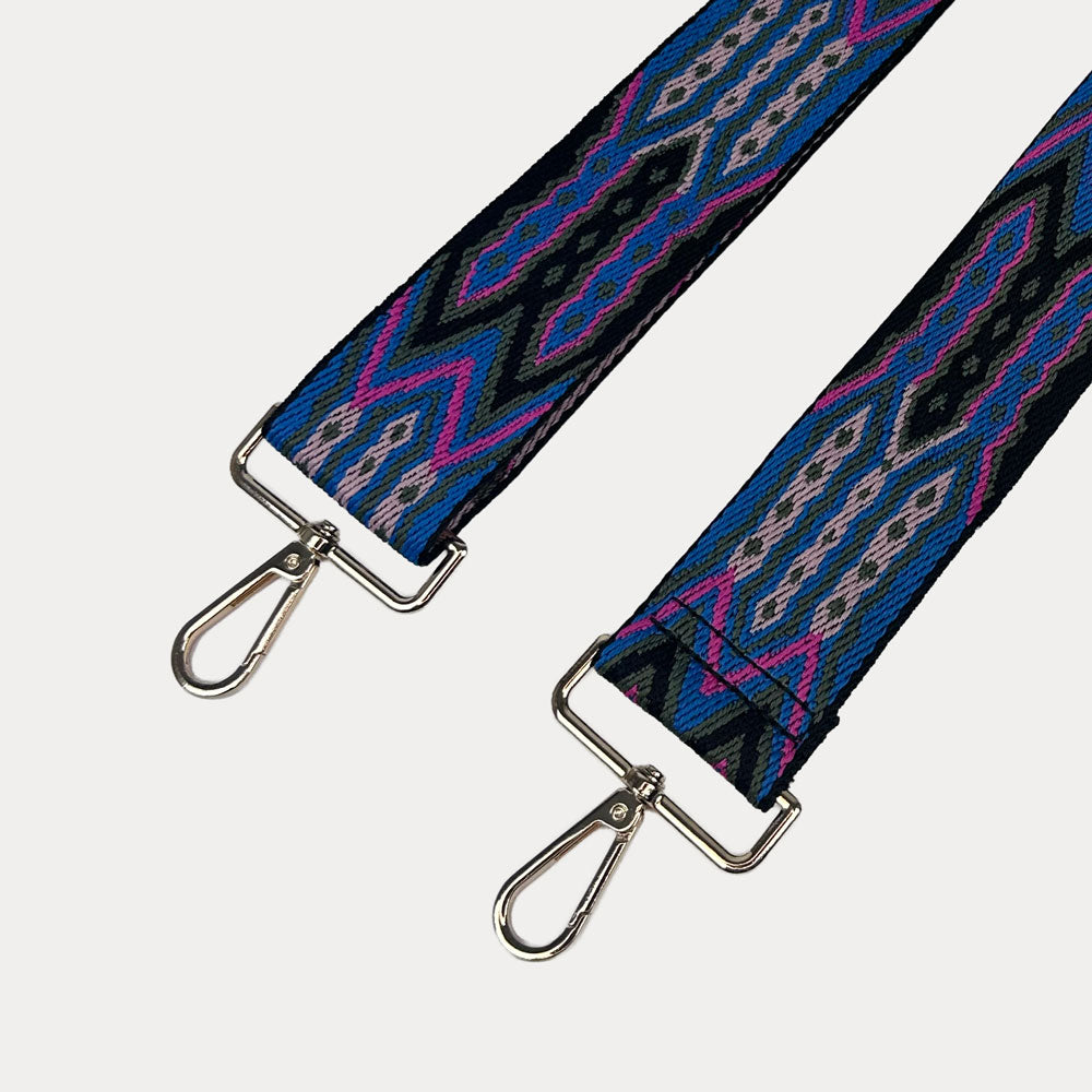 Blue, Pink, Black patterned strap with gold hardware on a light grey background