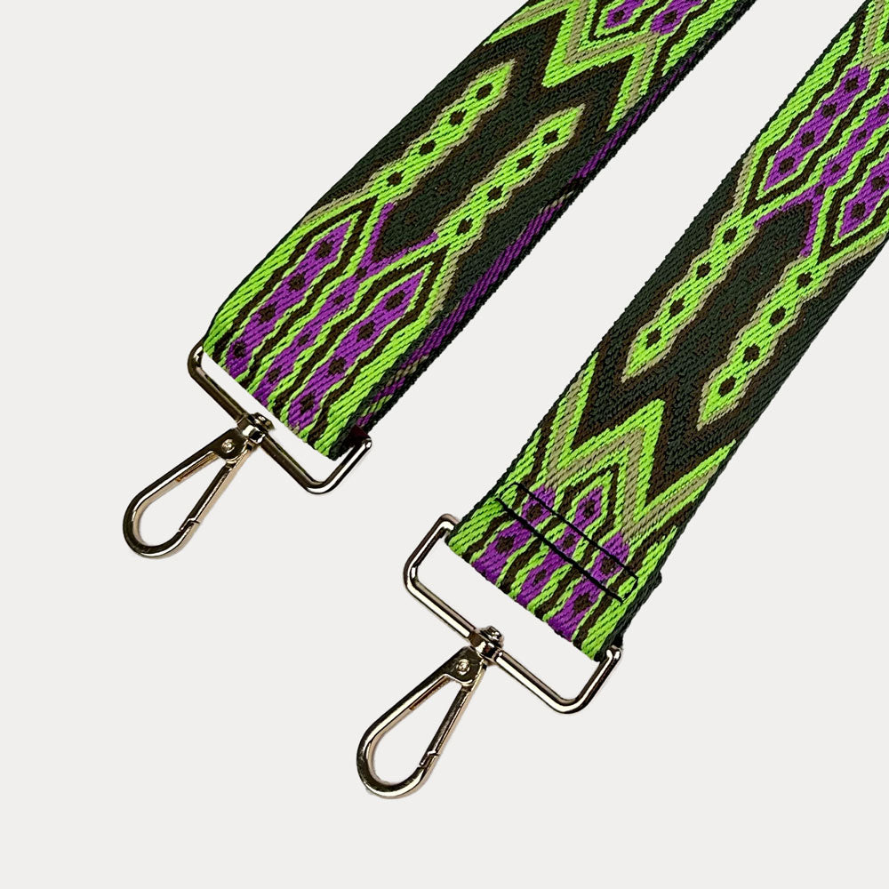 Lime, Army Pink patterned bag strap with gold hardware on a light grey background. Green and purple patterned strap on a white 