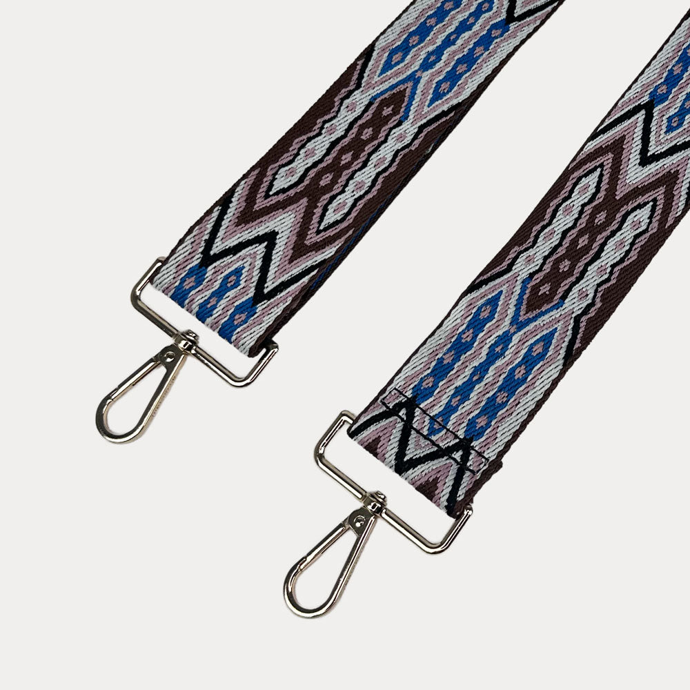 Light Pink, Brown, White patterned strap with gold hardware on a light grey background