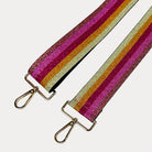 Bronze, Pink, Red, Gold, Yellow metallic striped bag strap with gold hardware on a light grey background