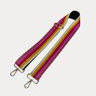 Bronze, Pink, Red, Gold, Yellow metallic striped bag strap with gold hardware on a light grey background