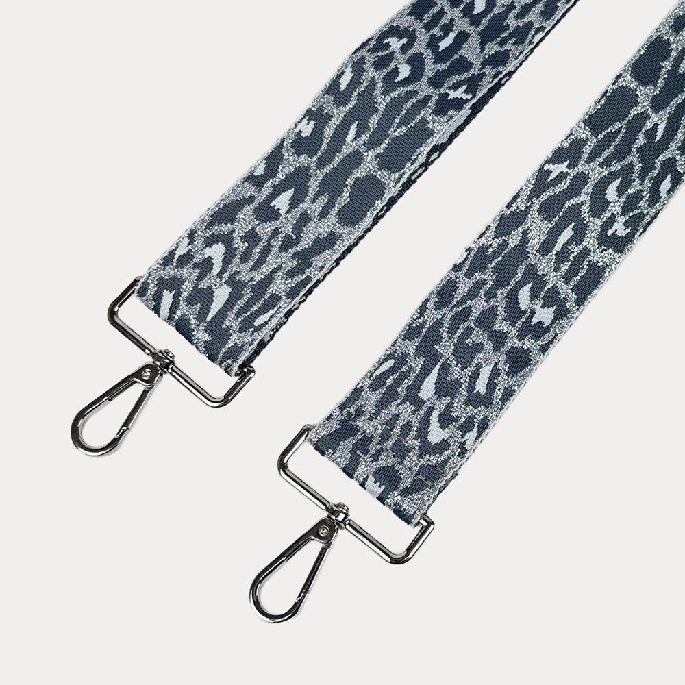 Glitter Silver Cheetah print strap with silver metal clasps on a white background