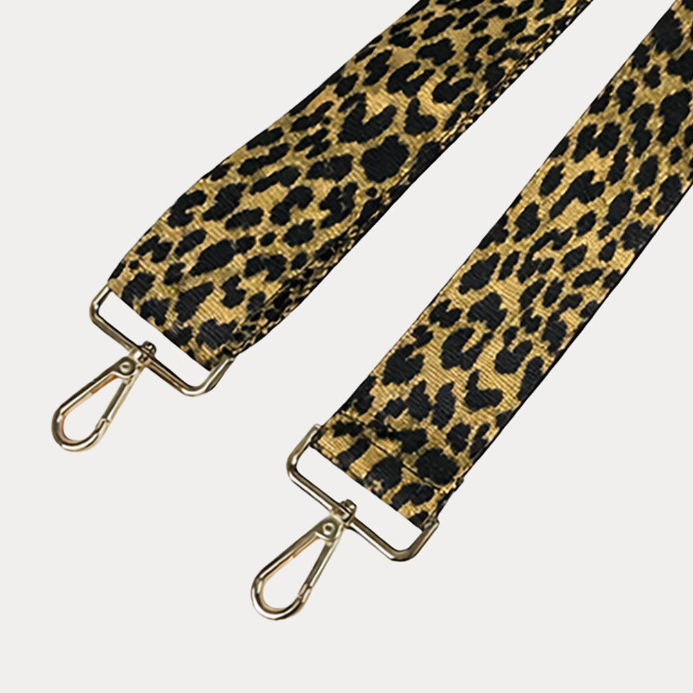 Glitter Gold Cheetah print strap with gold metal clasps on a light gray background