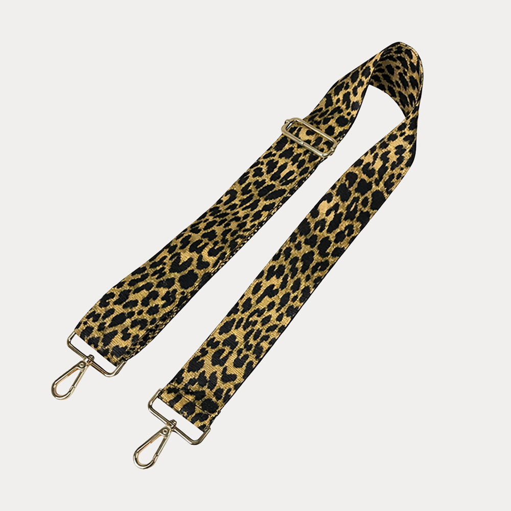 Glitter Gold Cheetah print bag strap on a light gray background