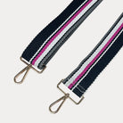Black, White, and Pink striped bag strap with gold hardware light gray background