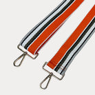Orange, Army, and White striped bag strap with gold hardware light gray background