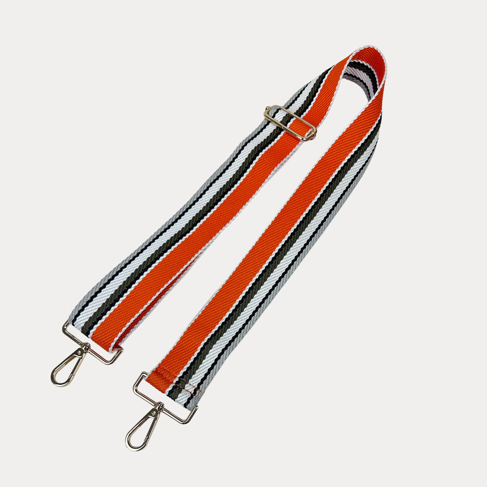 Orange, Army, and White striped bag strap with gold hardware light gray background