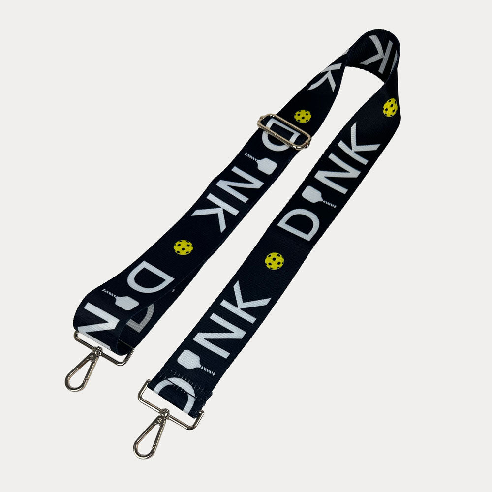 Black ground with Dink text with gold hardware bag strap