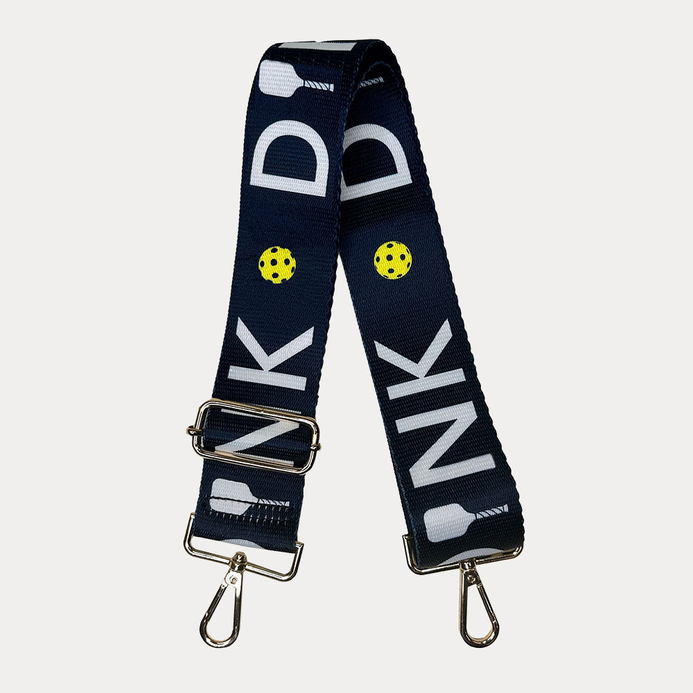 Navy ground with Dink text with gold hardware bag strap