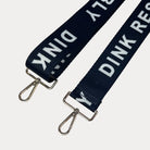 Black ground with Dink Responsibly text with gold hardware bag strap
