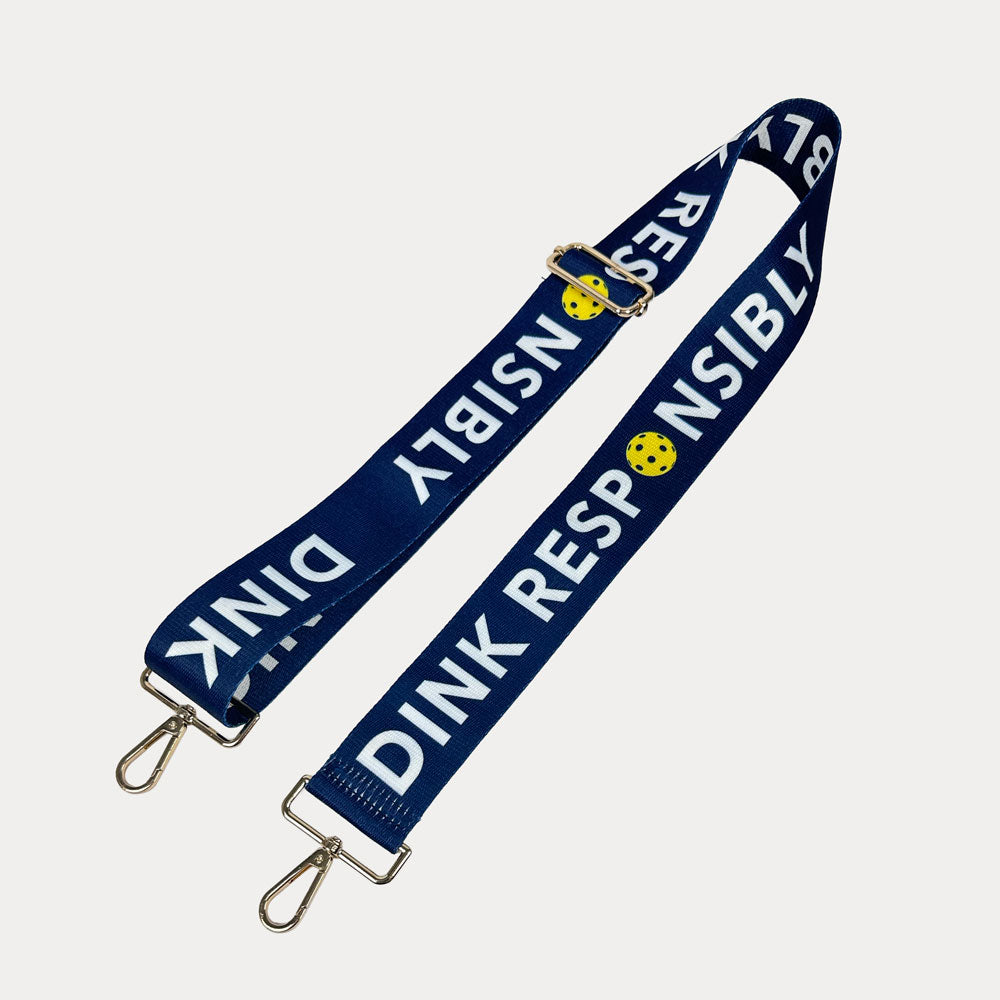 Navy ground with Dink Responsibly text with gold hardware bag strap