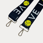Black ground with 'LOVE' text and tennis ball graphics with gold hardware bag strap