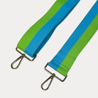 Lime and Aqua striped bag strap with gold hardware on a light gray background