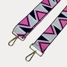 Pink, Navy, and grey Zip Zag Patterned bag strap with gold hardware on a light gray background