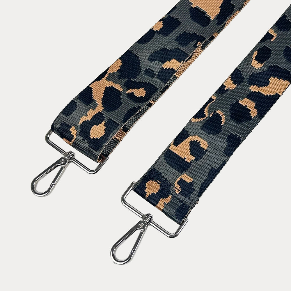 Dark Grey Leopard print bag strap with silver metal clasps on a white background